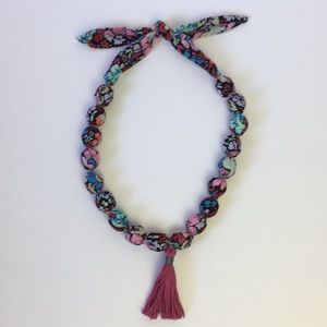Fabric covered wooden bead necklace With tassel